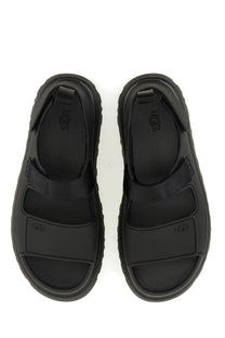 Ugg women’s sandal goldenglow black with thick rubber sole and adjustable black ugg straps for comfort