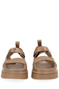 Ugg women’s sandal goldenglow brown featuring tan platform with wide straps and chunky sole in leather material