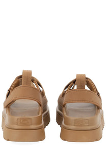 Ugg women’s sandal goldenglow brown with tan thick chunky soles and adjustable straps for casual wear
