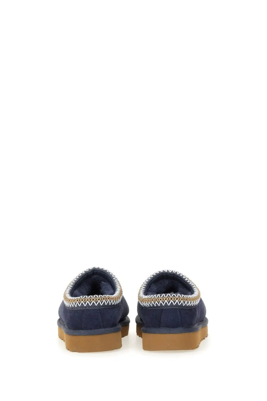 Ugg women’s sandalwood tasman blue navy suede booties with white and tan zigzag stitching along the collar