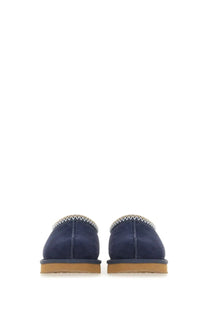 Ugg women’s sandalwood tasman blue navy blue suede moccasin slippers with zigzag stitched trim and tan rubber soles