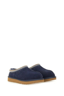 Ugg women’s sandalwood tasman blue navy blue suede slip-on mules with tan rubber sole and white zigzag stitching