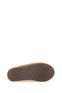 Back view of ugg women’s sandalwood tasman brown sandal showing brown rubber sole with geometric tread and ugg logo near heel