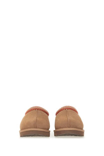 Ugg women’s sandalwood tasman brown tan suede moccasins with red and beige woven trim around the opening