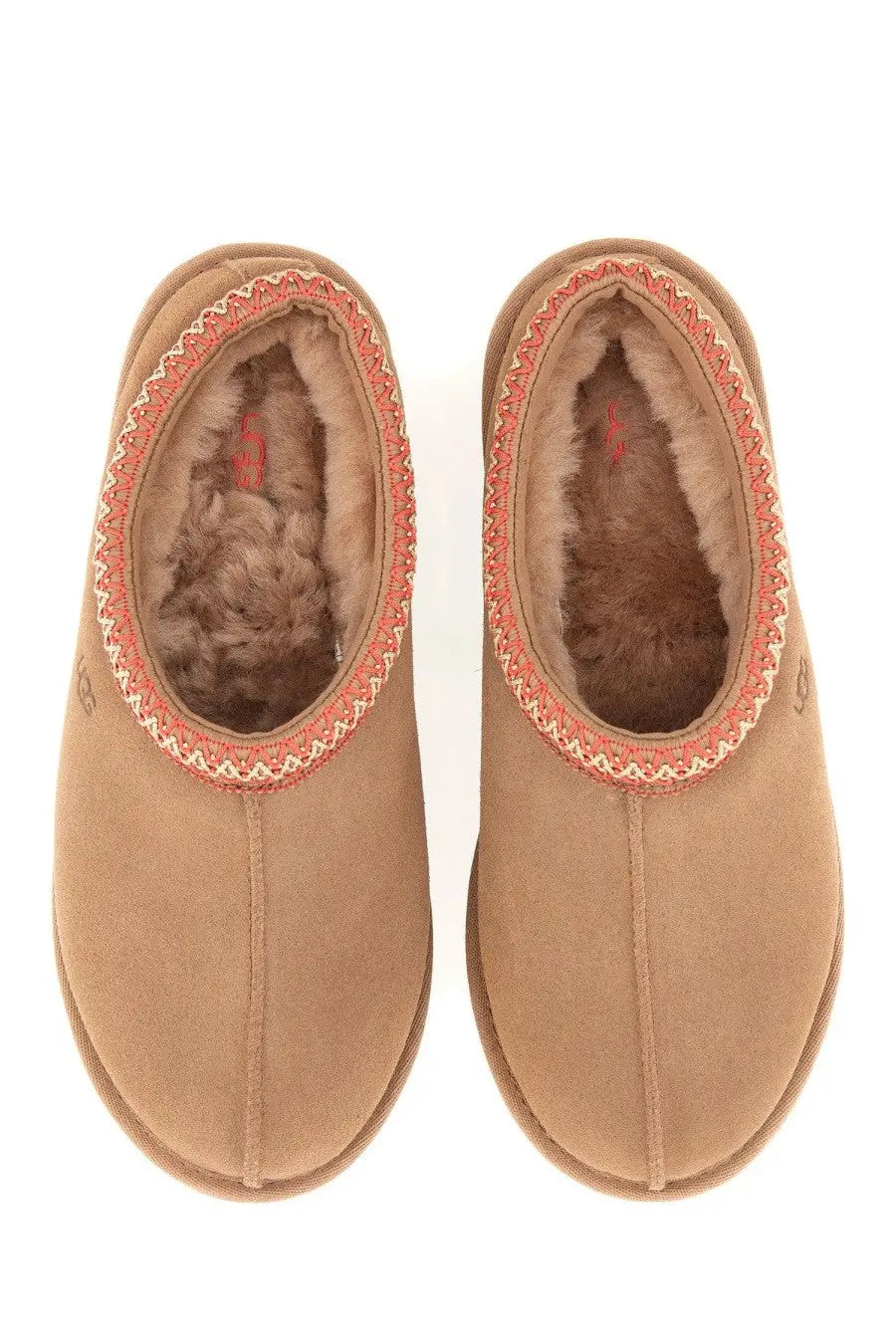 Ugg women’s sandalwood tasman brown tan suede slip-on slippers with plush brown shearling lining and coral stitched trim