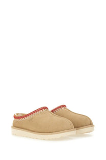 Ugg women’s sandalwood tasman white beige suede clog slip-on shoes with red braided trim around the opening