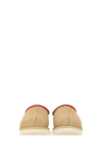 Ugg women’s sandalwood tasman white beige suede slip-on moccasins with red woven trim around the opening