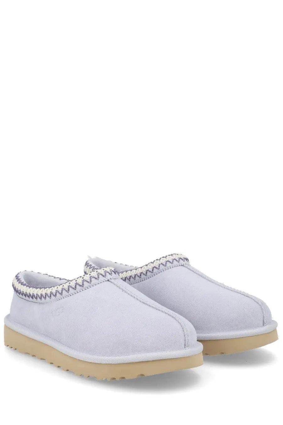 Ugg women’s tasman white slip-on moccasins in white suede with beige rubber sole and decorative zigzag stitching
