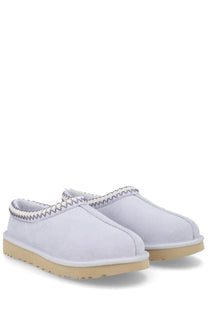 Ugg women’s tasman white slip-on moccasins in white suede with beige rubber sole and decorative zigzag stitching