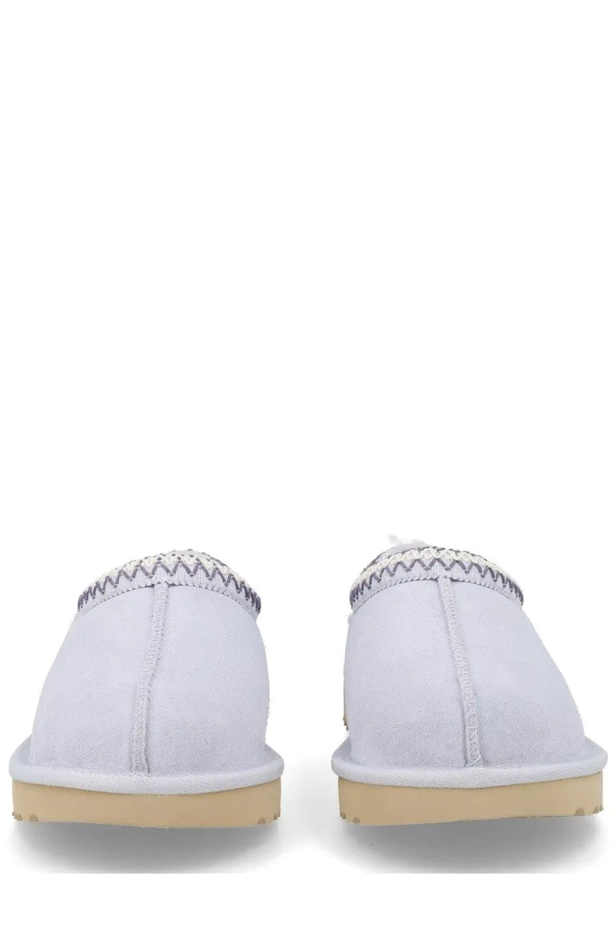 Ugg women’s white suede slip-on moccasins with zigzag stitched trim and tan rubber soles