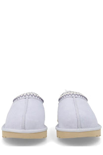 Ugg women’s white suede slip-on moccasins with zigzag stitched trim and tan rubber soles