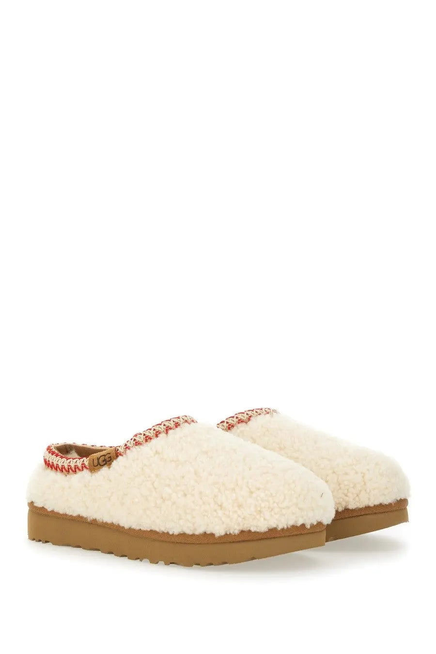 Ugg women’s slipper tasman white cream sheepskin slip-on with red and white braided trim and tan rubber sole