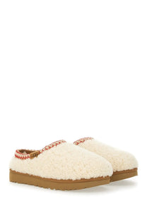 Ugg women’s slipper tasman white cream sheepskin slip-on with red and white braided trim and tan rubber sole