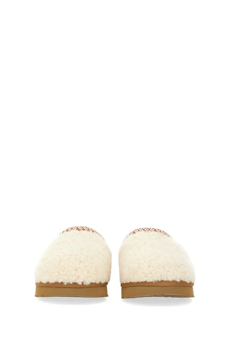 Ugg women’s cream-colored sheepskin slip-on slippers with decorative red and white patterned trim Tasman white