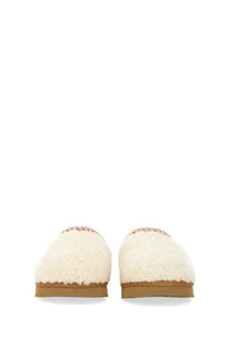 Ugg women’s cream-colored sheepskin slip-on slippers with decorative red and white patterned trim Tasman white