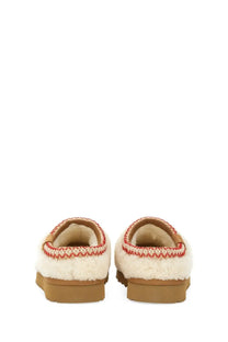 Ugg women’s slipper tasman white cream-colored shearling slip-on mules with red zigzag knit trim and tan rubber soles