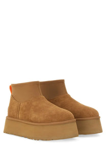 Ugg women’s stivale classic mini dipper tan suede platform boots with thick rubber sole and orange pull tab back view