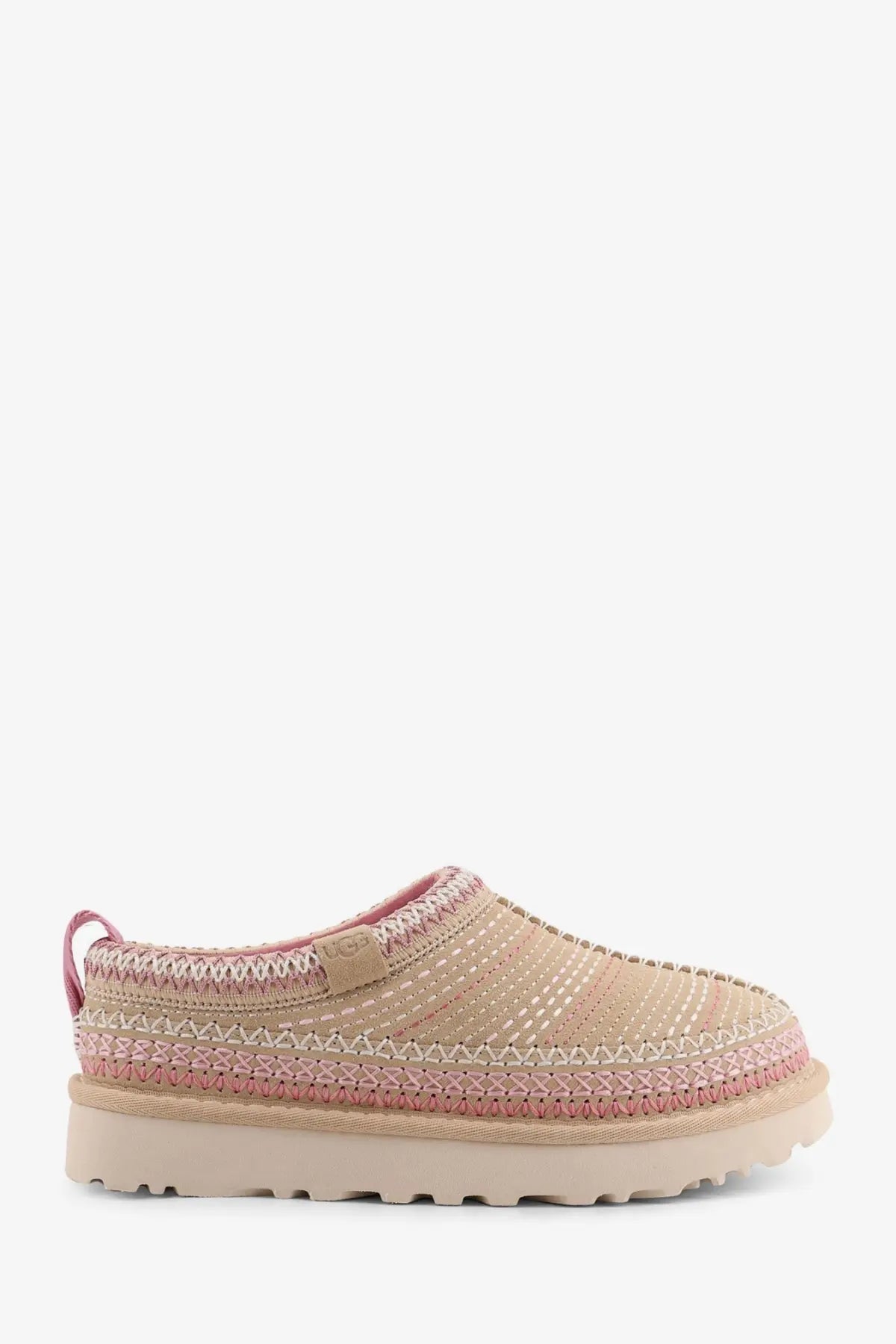 Ugg women’s tasman meadow suede sandals in beige featuring a beige and pink woven slip-on mule with braided upper and chunky sole