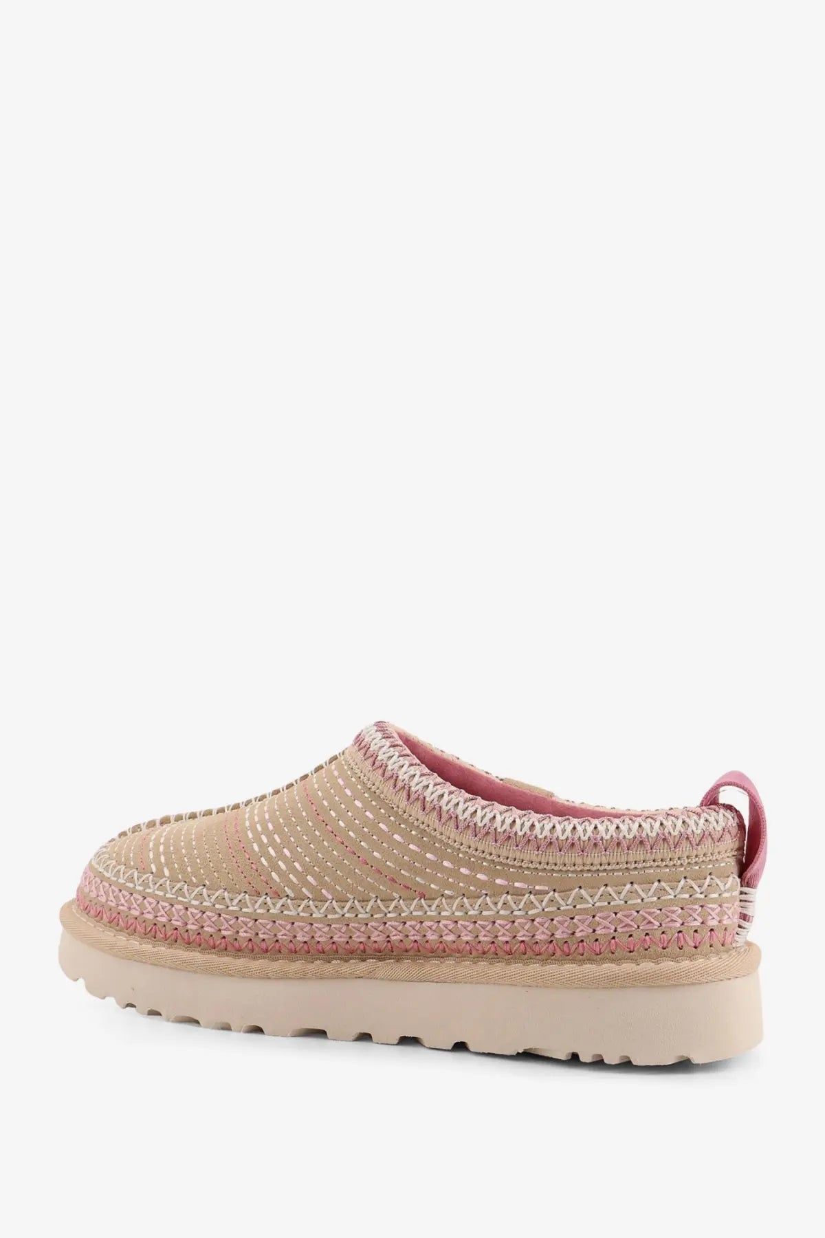Beige and pink woven ugg women’s tasman meadow suede slip-on sandals with textured braided design and rubber sole