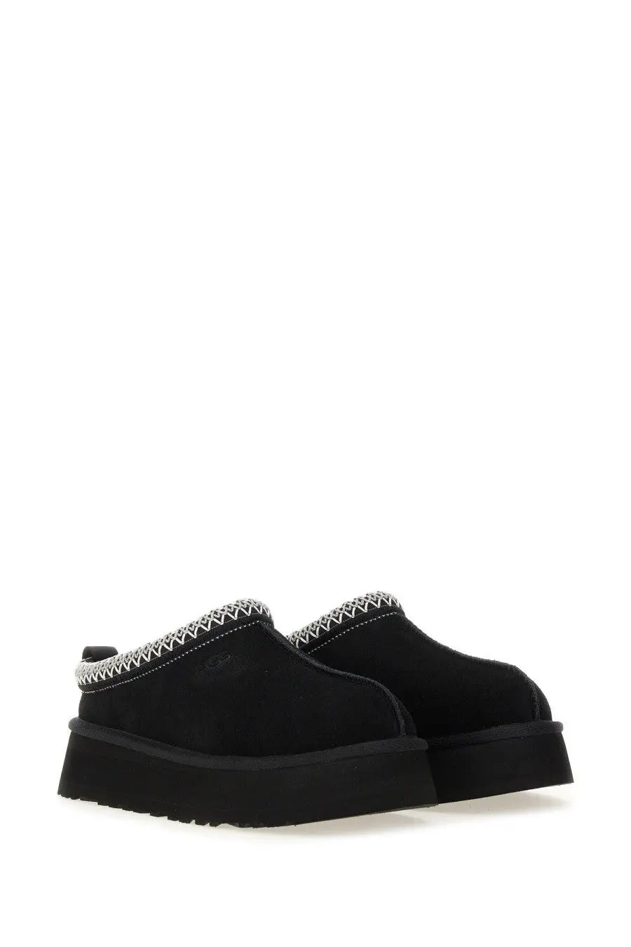 Ugg women’s Tazz II platform slip-on black leather mules with white zigzag stitching along the collar