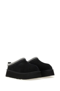 Ugg women’s Tazz II platform slip-on black leather mules with white zigzag stitching along the collar
