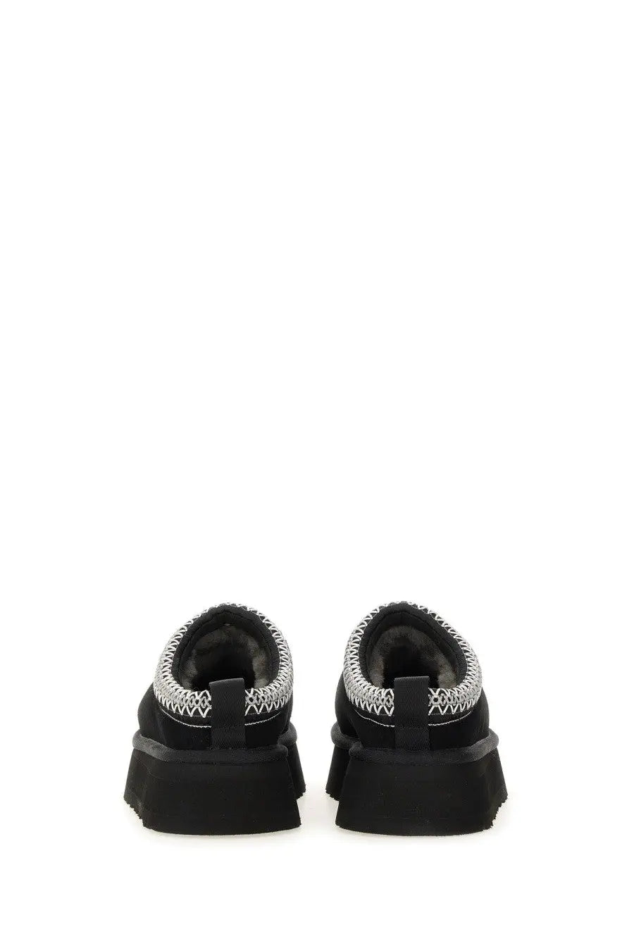 Ugg women’s tazz ii black suede slip-on shoes with thick rubber sole and silver zigzag stitching along the collar
