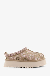 Beige ugg women’s tazz suede slip-on mule with soft pink and brown floral embroidered design on the upper