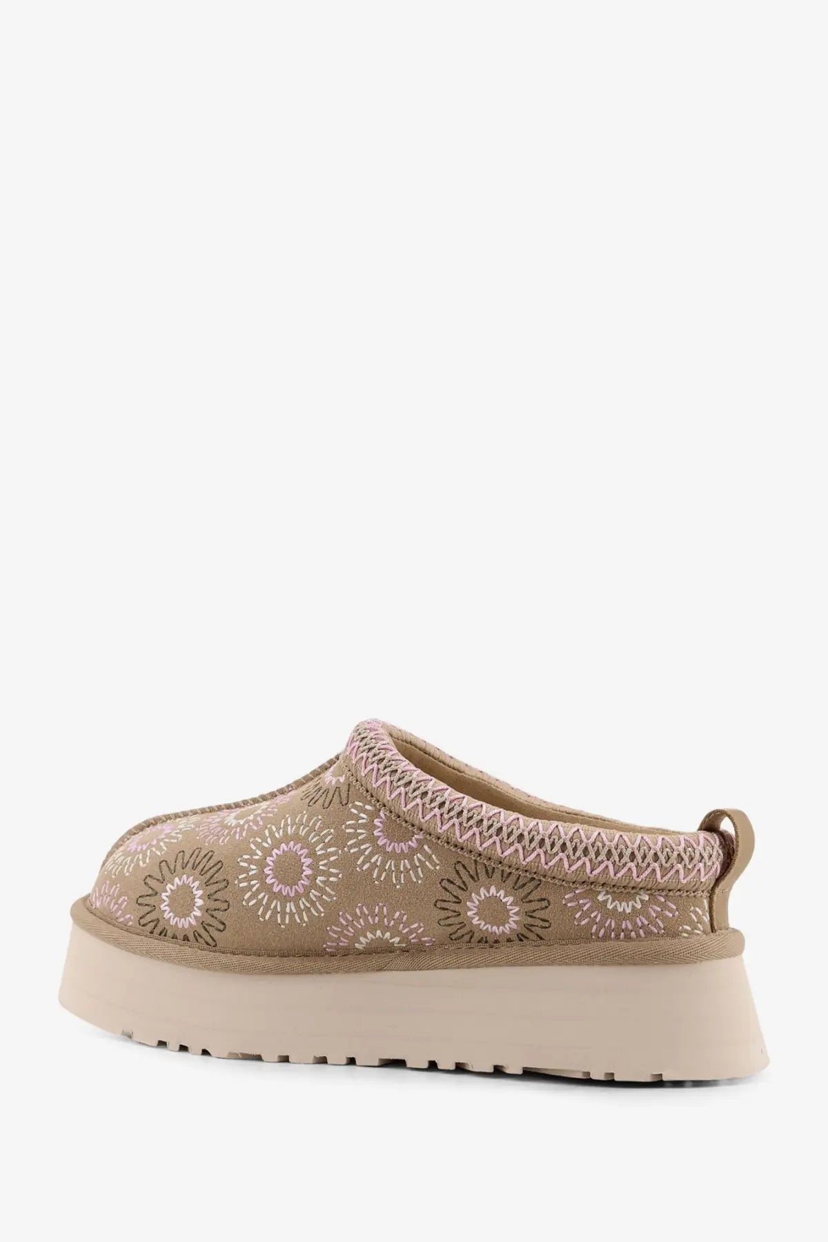 Beige ugg women’s tazz suede slip-on sandals with embroidered floral pattern and textured knit trim