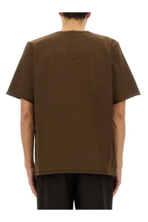 Back view of uma wang men’s brown cotton short-sleeved t-shirt with a subtle square patch on the back