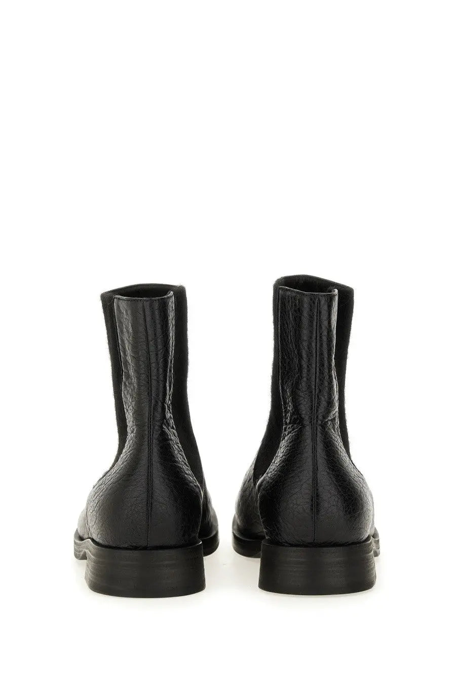 Uma Wang men’s black leather chelsea boots with textured surface and low block heels visible from the front