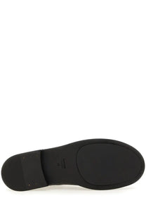 Black rubber sole with minimalist design and subtle branding on the back of uma wang men’s leather boot black