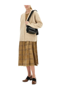 Black leather crossbody bag with sleek minimalist design shown alongside uma wang women’s beige cashmere cardigan