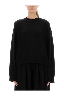 Uma wang women’s black oversized cashmere sweater with frayed hem and cuffs showing the front side