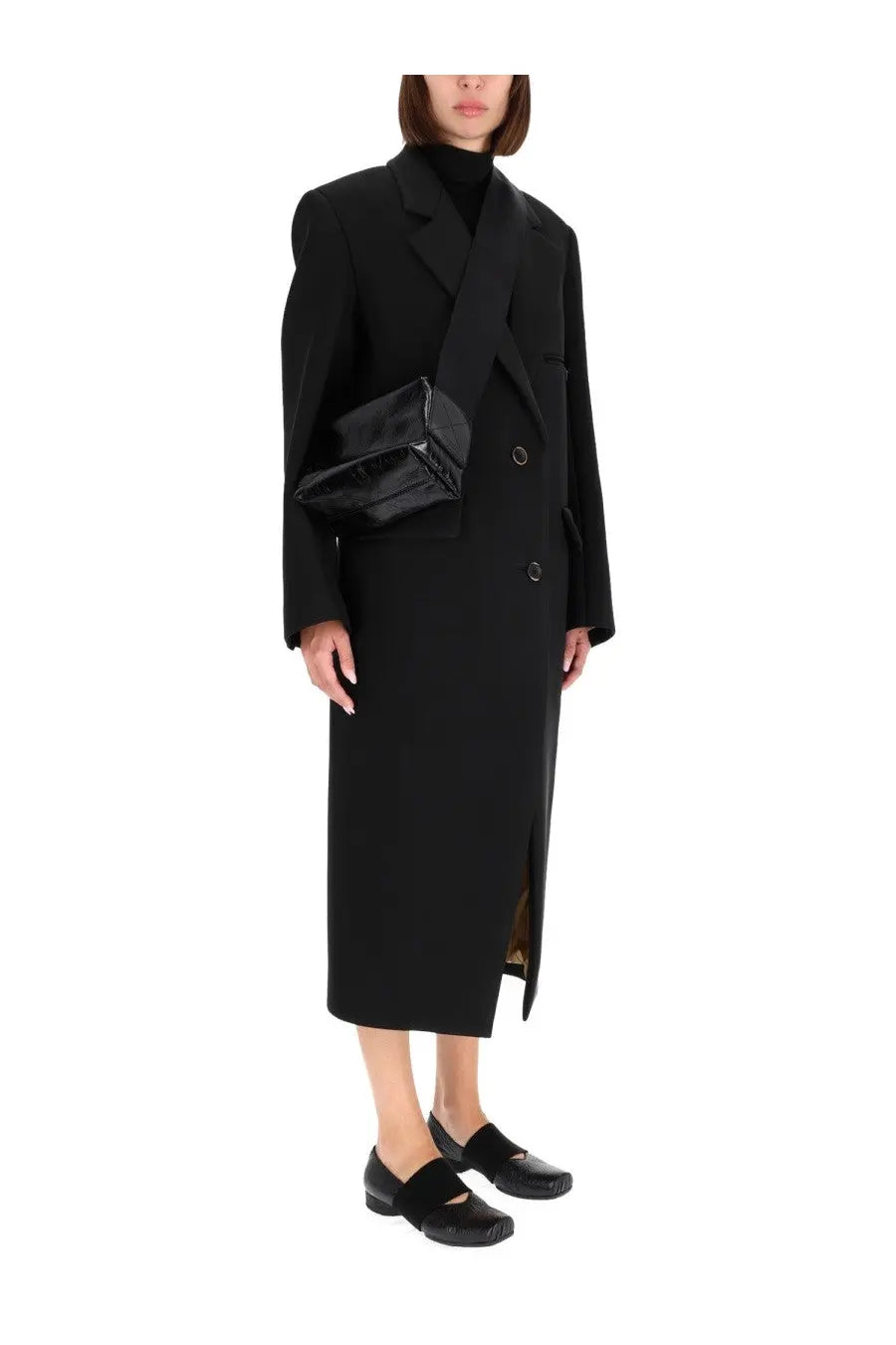 Black glossy patent leather crossbody bag with structured rectangular shape and minimalist silver hardware for women