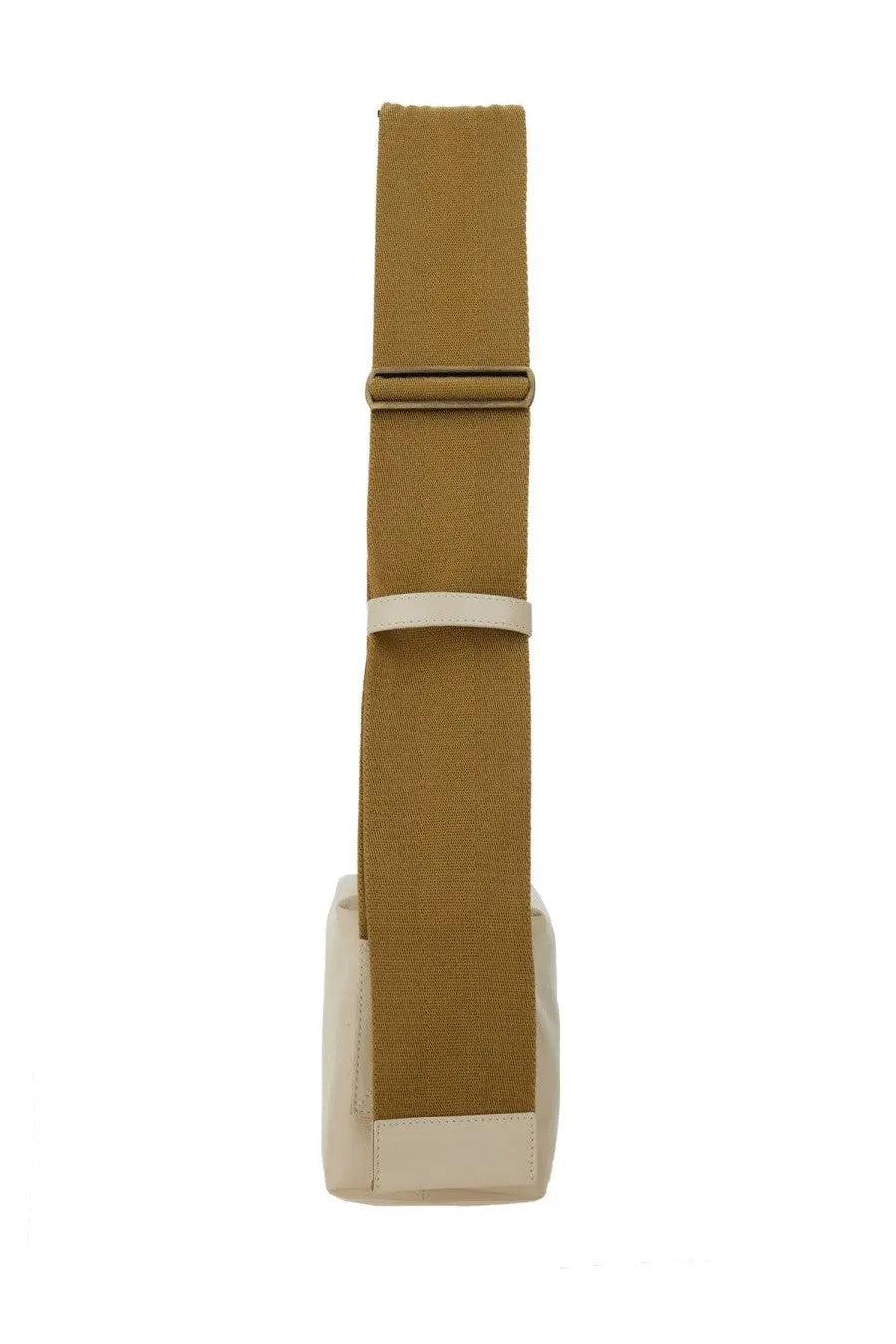 Tan canvas shoulder strap with white leather accent and metal buckle on uma wang women’s white leather shoulder bag