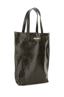 Uma Wang women’s medium tote bag in black glossy patent leather with gold-tone branding on the front