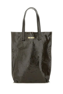 Black glossy vinyl uma wang women’s medium tote bag with gold branding on the front in brown tones