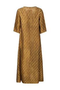 Uma wang women’s midi dress in apostle beige features a flowing golden-brown fabric with a subtle diamond pattern and short sleeves