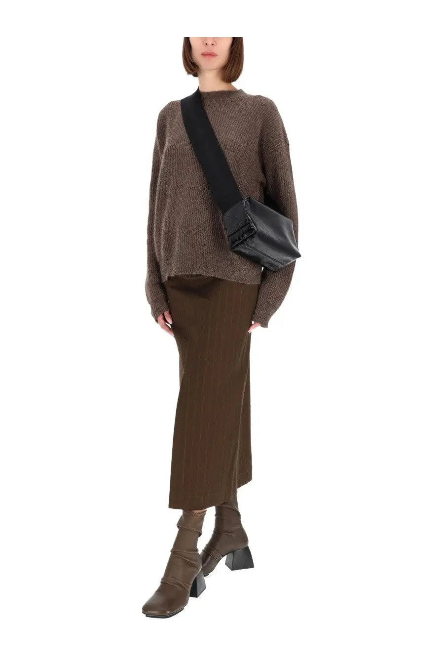 Black leather crossbody bag with structured rectangular shape and minimalist design paired with uma wang midi gad skirt brown