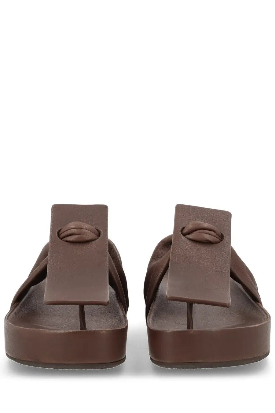 Uma wang women’s brown leather flip-flops with embossed lip design on distinctive rectangular strap
