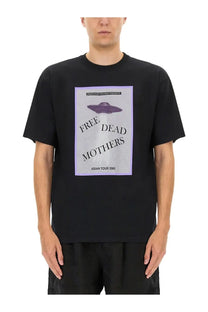 Undercover men’s black short-sleeved t-shirt with purple ufo graphic and lavender bordered gray label on front