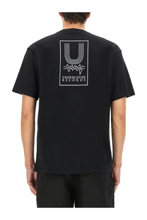 Undercover men’s black short-sleeved t-shirt with white rectangular undercover records logo and graphic elements