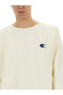 Cream-colored unisex champion sweatshirt with embroidered logo on left chest from undercover shirt white collection