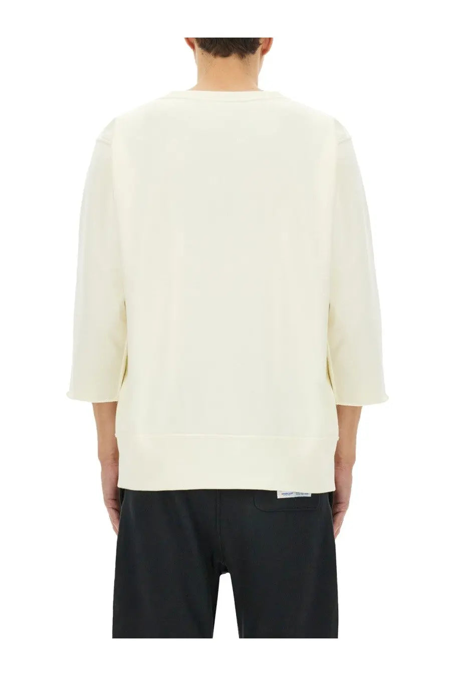 Cream-colored unisex under armour sweatshirt with three-quarter sleeves ribbed cuffs and a relaxed fit