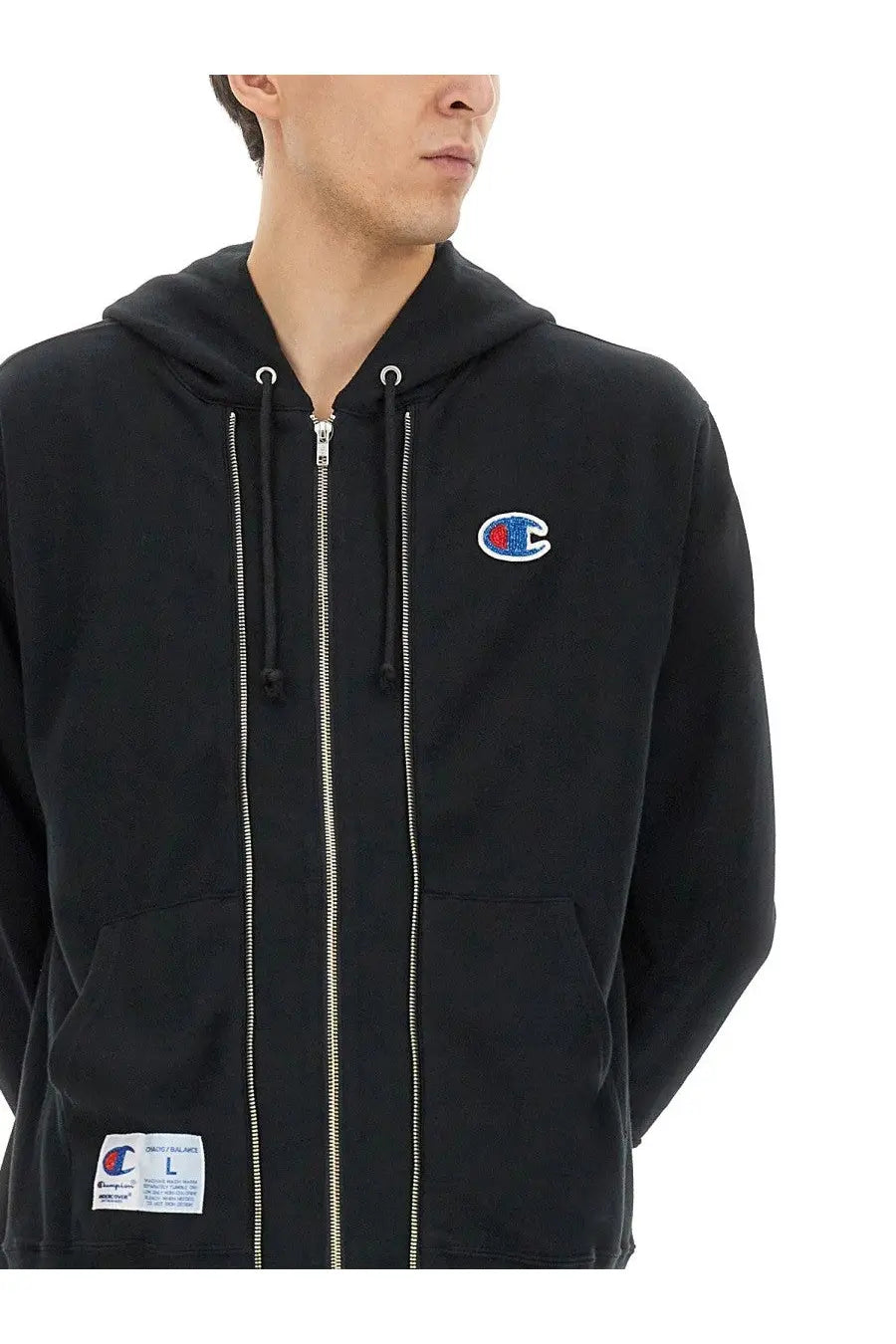Undercover unisex black champion hoodie with red and blue embroidered logo, full-length zipper, and front pockets