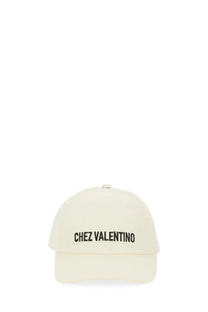 Valentino men’s white baseball cap featuring cream color and black embroidered chez valentino text on front