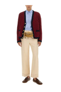 Tan leather belt bag with gold tone hardware and tassel detail for Valentino men’s cardigan red collection
