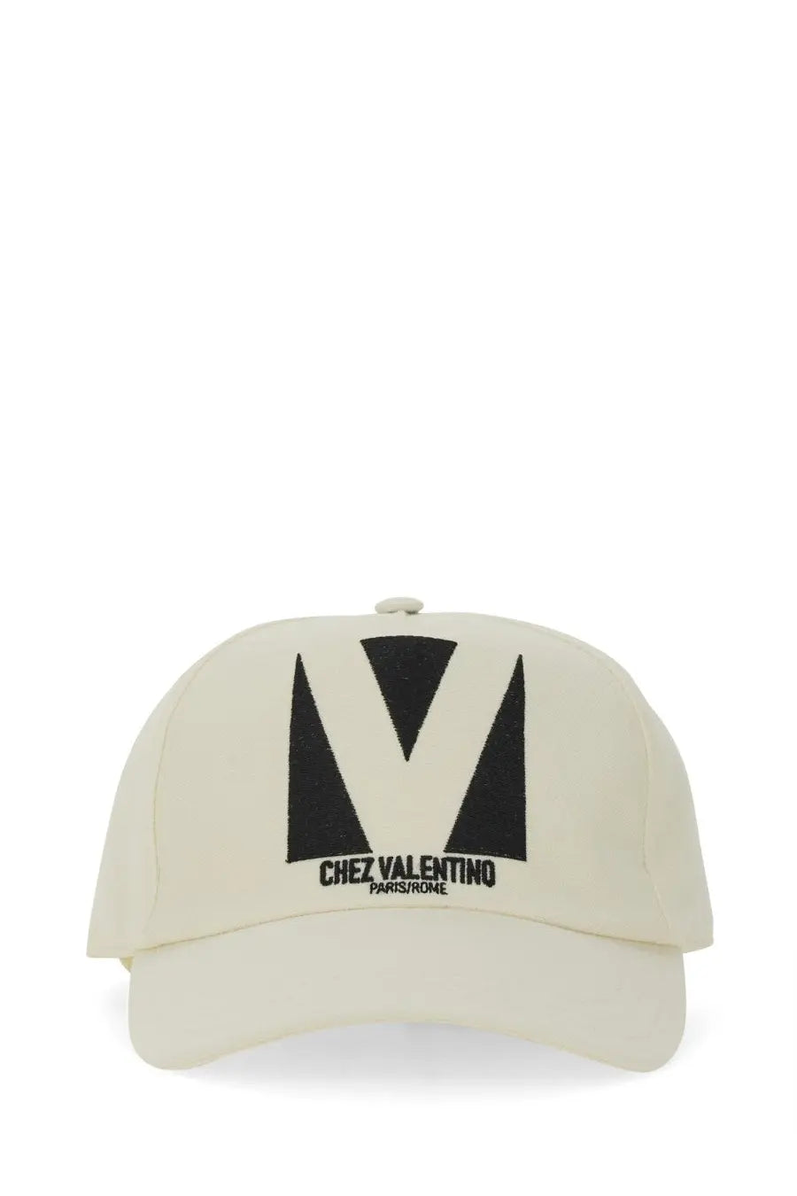 Cream-colored Valentino men’s embroidered baseball cap with bold black v logo and chez valentino paris rome text
