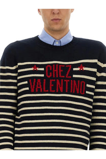Valentino men’s wool sweater in black and cream stripes with red chez valentino lettering and star motifs
