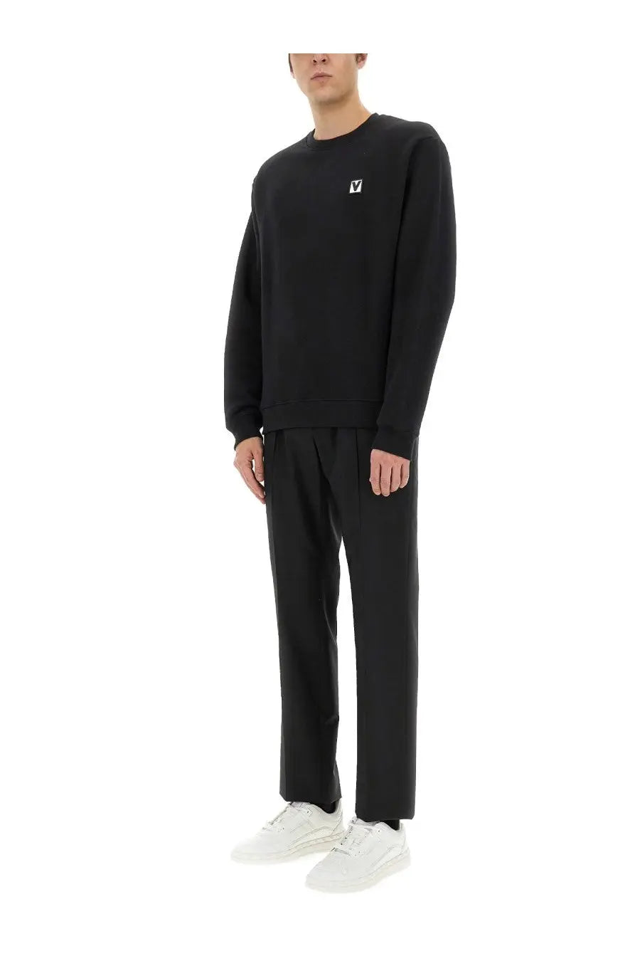 Valentino men’s black cotton crewneck sweatshirt with long sleeves and small white logo on left chest